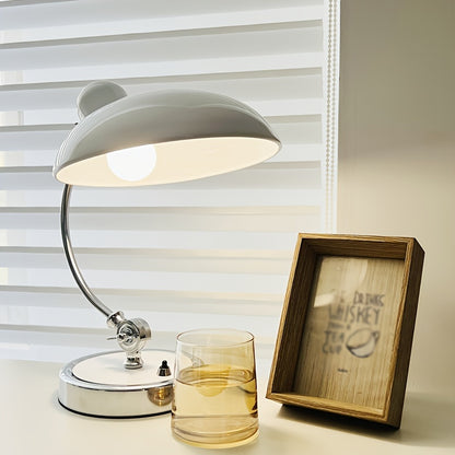 Minimalist and fashionable office desk lamp with creative ironwork, featuring exquisite black or white paint finish, serving as an artistic decorative ambiance table lamp, complete with a bulb.
